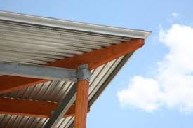 How To Install Corrugated Roof Panels Under A Deck Hunker Metal Roof Roof Panels Steel Roofing