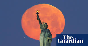 Crowds look on as the supermoon rises behind the fremantle war memorial at monument hill in fremantle, australia. April S Pink Supermoon Across The World In Pictures Science The Guardian