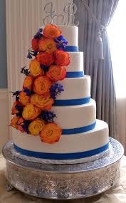 Orange And Blue Wedding Cake Autumn Colors Like The Blue And Change The Flowers Lacie Norman Orange Wedding Cake Wedding Cakes Blue Royal Blue Wedding Cakes