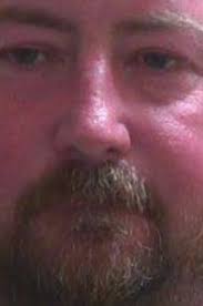 Man's body found wrapped in tarp, investigators arrest next door neighbor