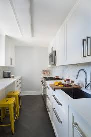 White Galley Style Kitchen With Black Herringbone Pattern Floor Tiles Contemporary Kitchen