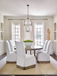 White Parsons Chairs In A Simple But Pretty Dining Room Beige Dining Room Slipcovers For Chairs Dining Room Inspiration