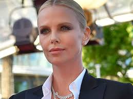 Charlize Theron just destroyed the red carpet at Cannes in a friggin'  tuxedo