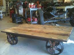 We are sharing the cutest farmhouse diy barn wood cart coffee table! Coffee Table From Old Mine Cart Wheels Rustic Dining Table Coffee Table Rustic Dining