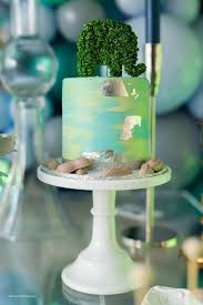 Gold stars really pop against the dark blue ombre icing on the baby boy's cake. Kara S Party Ideas Elephant Baby Shower Kara S Party Ideas