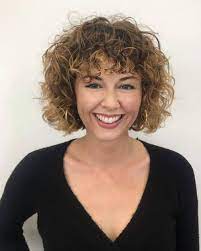Icy blonde haircut with undercut. 16 Blonde Curly Hair Ideas Trending In 2021