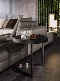 It hosts a top in calacatta marble, grigio orobico marble, black pâte de verre glass or brushed oak with moka colour lacquer finish. Kay Coffee Tables En