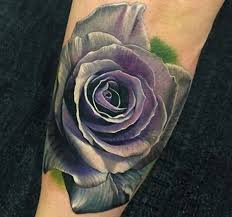 A purple rose tattoo inked on upper thigh of a women. Rose Tattoo Designs With Meanings 30 Concepts Purple Rose Tattoos White Rose Tattoos Blue Rose Tattoos
