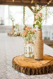 Country wedding flowers in mason jars. 20 Mason Jar Wedding Centerpiece Ideas Craftsy Hacks