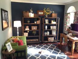 Reading nook highlighted with geometric wallpaper. Dark Blue Accent Wall For A Home Office Or Study Blue Accent Walls Striped Accent Walls Accent Walls In Living Room