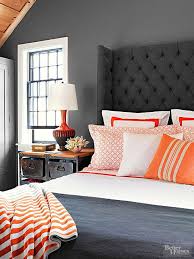 Along with the wood tones from the headboard, the dark gray fabrics help to balance the stark white walls that carry throughout this bedroom from ashley montgomery design. Small Space Dos And Don Ts Grey Headboard Bedroom Bedroom Colors Bedroom Headboard