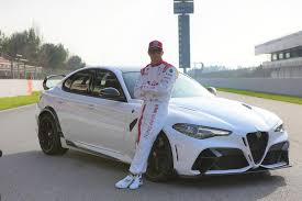 Former ferrari world champion and current alfa romeo driver kimi raikkonen isn't a man you'd imagine in the form of a smiley. Kimi Raikkonen Shows Off Alfa Romeo Giulia Gta In Bahrain Carbuzz