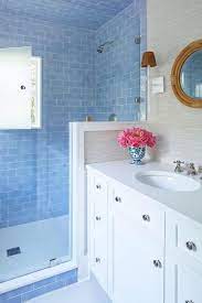 Grasscloth wallpaper in bathroom | peacock blue, peacock blue grasscloth wallpaper, dining room wallpaper. Julia Engel Gal Meets Glam Blogger Home Tour Charleston Southern Living Blue Subway Tile Phillip Jeffries Vinyl Grasscloth Wallpaper The Glam Pad