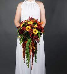 Find a florist from your city and order online. Cascading Fall Colors Wedding Bouquet With Real Preserved Flowers And Greenery Yellow Fall Wedding Colors Fall Color Wedding Bouquets Red Rose Bridal Bouquet