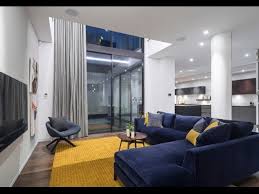The dining set which consists of navy and white dining chairs and wood table with glass top and chrome legs become the focal point of the room with the white and navy background color. Appealing Living Rooms With Gold And Navy Accents Decorating Ideas Youtube