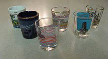 A typical serving of a shot in a bar in the united states is about 1.5 ounces. Shot Glass Wikipedia