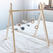 Make A Simple And Stylish Gym For Your Baby With This Easy Step By Step Tutorial Diy Baby Gym Diy Baby Stuff Baby Gym