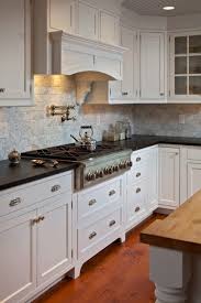 The bank near the fridge and at far right have sliding doors concealing storage and the main bank is built as a shadow box with a rope light to help illuminate the. Moulding At Bottom Of Upper Cabinets Traditional Kitchen Cabinets Kitchen Renovation Kitchen