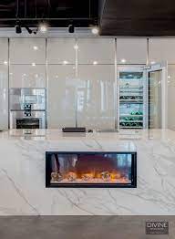 Stoveupscale jennair cooktop with downdraft venting in kitchen island. A Unique Fireplace In A Kitchen Island Unique Fireplace Kitchen Appliance Trends Luxury Appliances