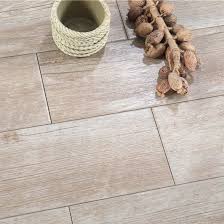 Most homeowners opt for durable glazed ceramic tile in the $2 to $4 per square foot price range. China Price Per Square Foot Wood Look Ceramic Tile In Living Room China Wood Tile Wood Ceramic Tile