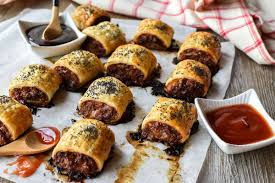 Meanwhile prepare the pastry by rolling and dividing into 2 rectangles. Australian Sausage Rolls With Cheese And Bacon Marcellina In Cucina
