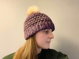 I wore my beanie yesterday and found out it's way too big for me. So I  tapered it by frogging 4 rows ( ended with 12 puff rows) and added a pompom