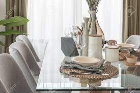 The dining room glass table have prime qualities and discounts that give you value for money. Table Set On Glass Dining Table In Modern Dining Room Interior Design Concept Stock Photo Picture And Royalty Free Image Image 84322805