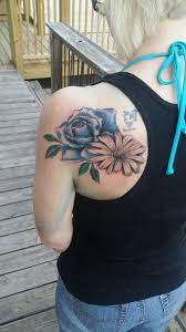 Women's rose and daisy tattoo. In Love Blue Rose With Daisy Rose And Daisy Tattoo Daisy Tattoo Tattoos Flower Tattoo Shoulder