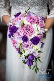 Purple is associated with royalty. Beautiful Purple Pink And White Cascading Bridal Bouquet Flowers Are Purple Lisianthus White Hydr Purple Flower Bouquet Purple Bridal Bouquet Purple Wedding
