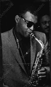 Ray Charles playing his sax (Edgar Willis in background). From an April  1959 wire photo.