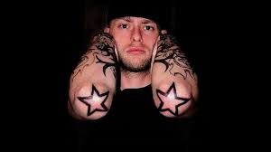 Black tribal star tattoos on left half sleeve. Awesome Star Tattoo For Men Sleeves Youtube