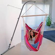 The hammock swing is turquoise, made of an aluminum stand. Pin By Erica Comberger On Design Decor Indoor Hammock Chair Hammock Chair Stand Hanging Chair With Stand