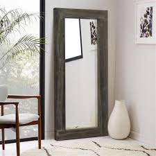 The lines of the sleek modern lighting and colorful floral arrangement captured in the round mirror's reflection create stunning geometry—a testament to the fact that styling your mirror thoughtfully can elevate it to another level. Floor Mirrors Mirrors The Home Depot