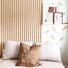 Wood feature wall behind bed. Homeowner Creates Stunning Wood Panelling Feature Wall On A Budget