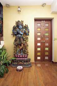 With my deep rooted indian origin, i find myself drawn to countries that are steeped in history, culture, art, architecture…….when it comes to design aesthetics, it's no surprise. Hindu Home Decor With Krishna Statue House Main Door Design Indian Home Design Home Door Design
