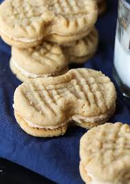 When the cookies have cooled down, use a butter knife to spread a thin layer of filling on the flat side of a cookie and then press another one on top. Homemade Nutter Butters Will Quickly Become Your New Favorite Cookie Soft Loaded With Pean Nutter Butter Cookie Recipe Homemade Cookies Butter Cookies Recipe
