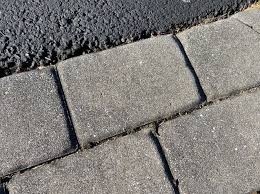 This will also help to protect the concrete or asphalt from chipping or cracking. Belgian Block And Pavers Dressing Up An Asphalt Driveway All About The House