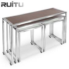 This sturdy coffee table features a thick wooden tabletop with visible wood grain detailing. China Modern Coated Rectangular 3 Piece Metal Nest Coffee Table Set With Wheels Luxury Wooden Nesting Coffee Tables China Nesting Tables Nesting Coffee Table