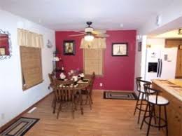 Red relates well with elements of food and dining, so spaces where you make food or serve food gets the right bit of drama with an accent wall carrying a shade of red. Accent Wall Dining Room Wild Country Fine Arts