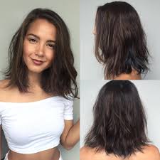 No doubts, conservative and classy hairstyles never go out of fashion. Brunette Layered Lob With Messy Beach Texture And Subtle Blue Peekaboo Highlights By Hairstyleology Medium