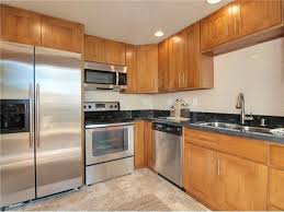 honey oak cabinets, kitchen flooring