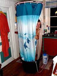 Shower Curtain On A Hula Hoop Hanging From A Hook In The Ceiling On The Floor A Wide Barrel And Our Hand Pumped Ca Camping Shower Shower Tent Camping Trailer