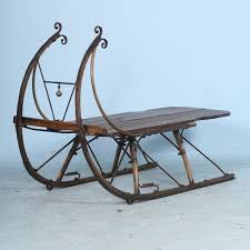 The tabletop is made from solid pine wood and has a butcher block style with visible wood grain and knots for a rustic, antique look. Antique Scandinavian Sleigh Vintage Sled Coffee Table Antique Inspiration