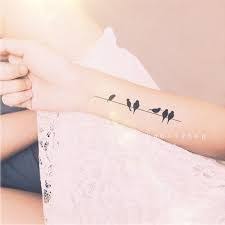 Bird On A Wire Tattoo Meaning Image Result For Women S Foot Tattoos Birds On A Wire Foot Tattoos Tattoos For Women Foot Tattoos For Women