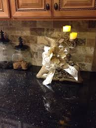 Black galaxy granite is available in both slabs and tiles to allow for creative and coordinated installations. Pin By Sonja Negron On Home Decor Backsplash With Dark Cabinets Trendy Kitchen Backsplash Trendy Kitchen Tile