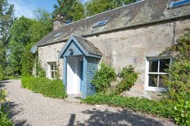 Exposed cabinetry, wood floors, vintage lighting and a retro sink are the stars in this charming kitchen. Perthshire Cottages Walkhighlands