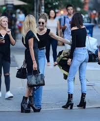 Bella is wearing a cult gaia tunic and levi's jeans. Kendall Jenner Shamelessly Flashes Her Nipples As She Grabs Bite To Eat With Gigi Hadid And Hailey Baldwin Mirror Online