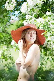 The Image Of A Beautiful Half-naked Woman Among Flowering Gardens Stock  Photo, Picture and Royalty Free Image. Image 7624139.