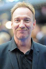 David thewlis was born david wheeler in 1963 in blackpool, lancashire, to maureen (thewlis) and alec raymond wheeler, and lived with his parents above their combination wallpaper and toy shop during his childhood. 2v3abh3evewhqm