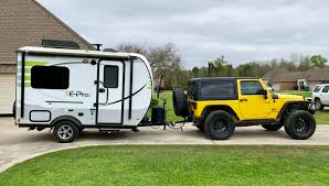 Before you pull any trailer other than those 1200 lb or so light units always consult the owner's manual. My Jeep Got A New Friend Wrangler